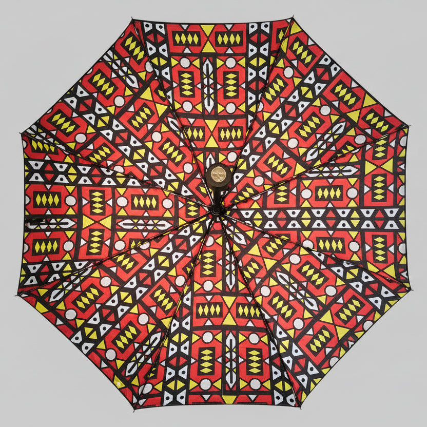 Umbrella with a colorful geometric pattern on a white background