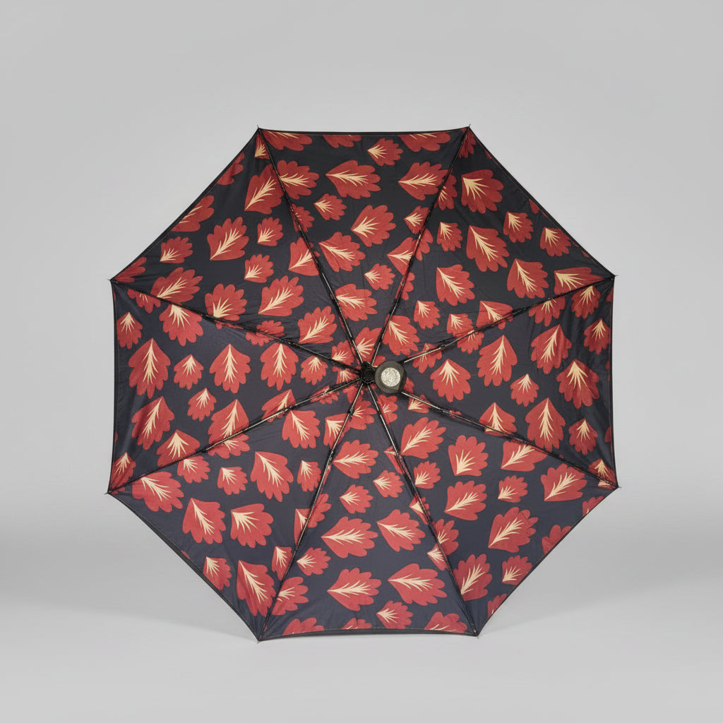Umbrella with red floral pattern on a gray background