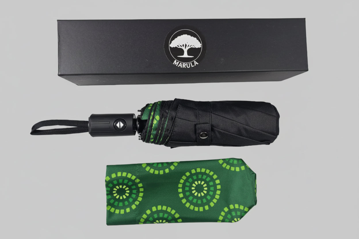 Green patterned umbrella with black handle and Marula logo box on a white background