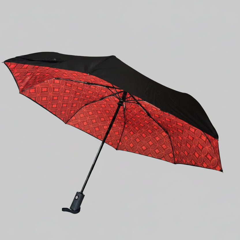 Red and black umbrella on a white background